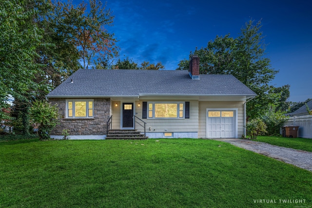 ranch-style home with a garage and a lawn