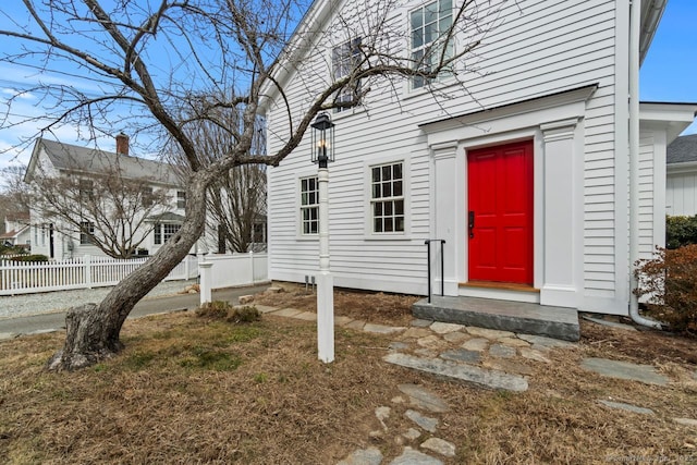 doorway to property with fence