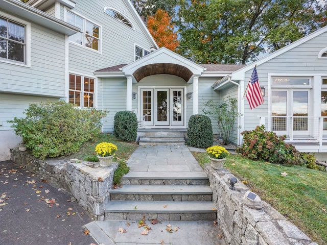201 Shore Rd, Greenwich, CT 06830 - property entrance with a shingled roof and french doors
