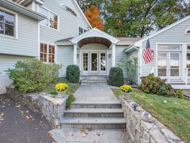 201 Shore Rd, Greenwich, CT 06830 - property entrance with french doors and roof with shingles