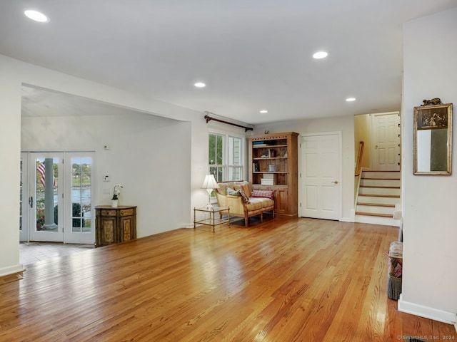 201 Shore Rd, Greenwich, CT 06830 - sitting room with light wood-style floors, recessed lighting, baseboards, and stairway