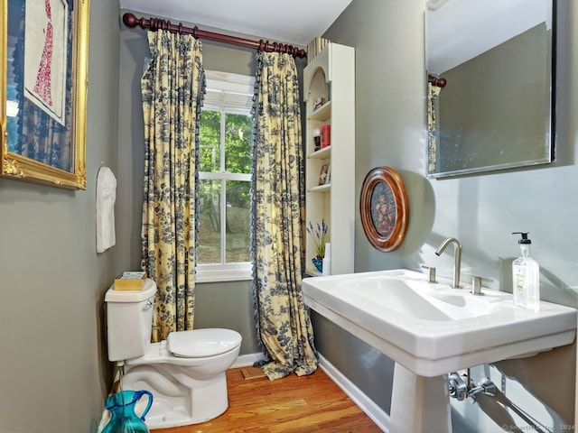 201 Shore Rd, Greenwich, CT 06830 - bathroom featuring toilet, baseboards, and wood finished floors