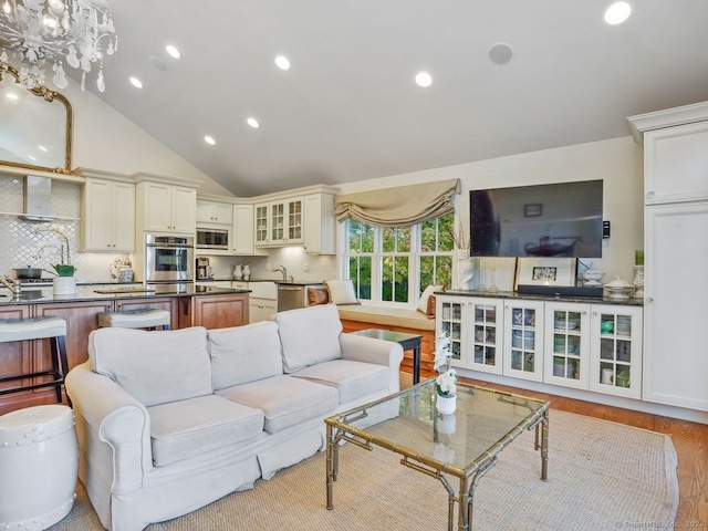 201 Shore Rd, Greenwich, CT 06830 - living area featuring recessed lighting, lofted ceiling, and wood finished floors