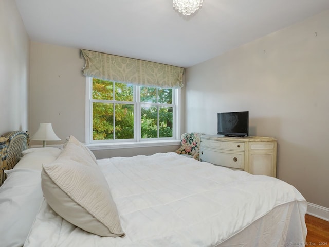 201 Shore Rd, Greenwich, CT 06830 - bedroom featuring baseboards and wood finished floors