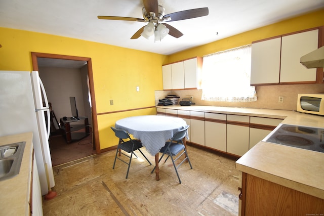 kitchen featuring white appliances, white cabinetry, and ceiling fan