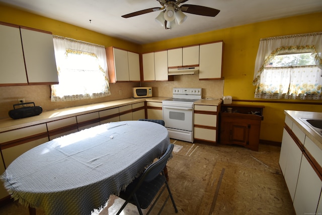 kitchen with ceiling fan, hardwood / wood-style flooring, white appliances, and white cabinetry