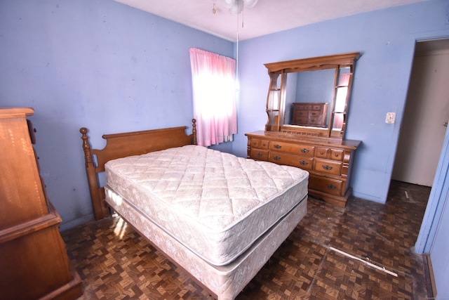 bedroom with dark parquet floors