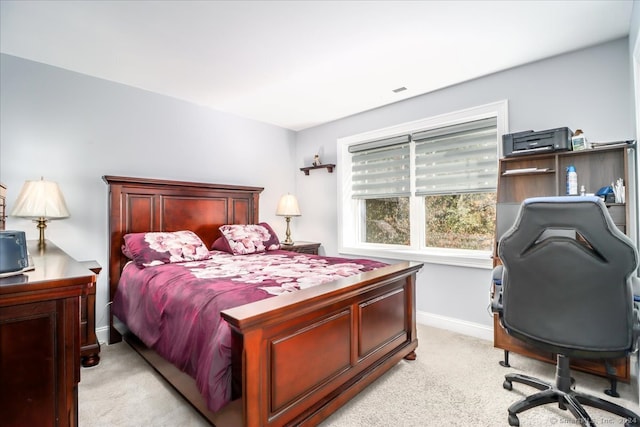 bedroom with light carpet