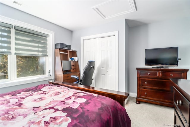 carpeted bedroom with a closet