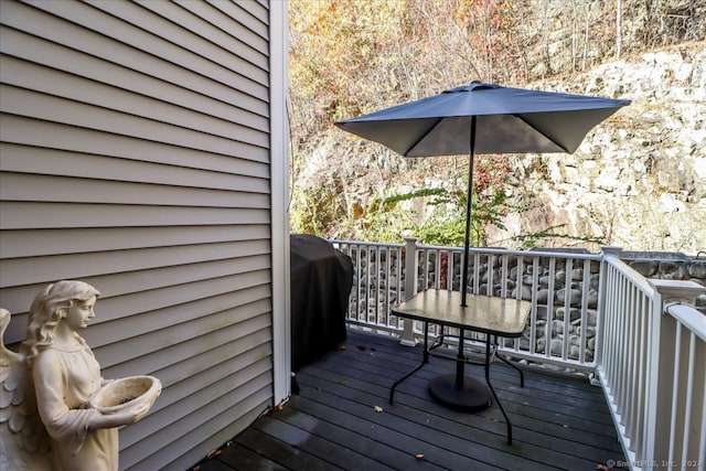 wooden deck featuring grilling area