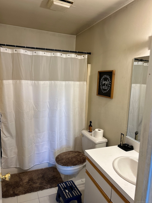 bathroom with vanity, toilet, tile patterned floors, and a shower with shower curtain