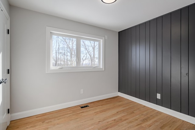 unfurnished room featuring light wood-type flooring