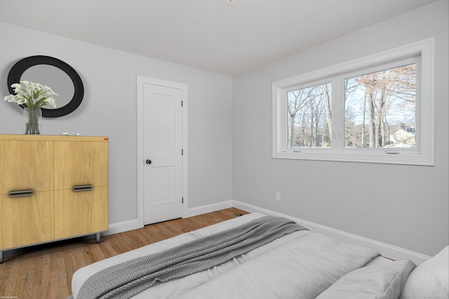 bedroom with light wood-type flooring