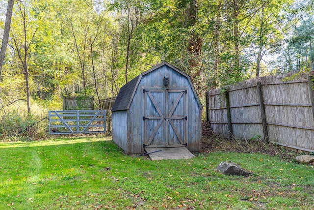 view of shed with fence