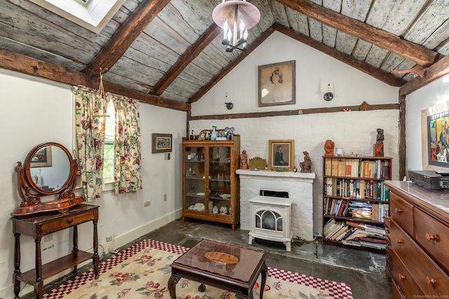 living room featuring a skylight, baseboards, wood ceiling, a wood stove, and beam ceiling