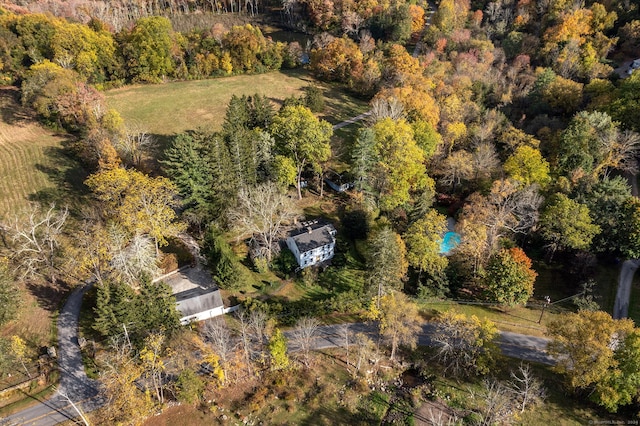 drone / aerial view featuring a forest view