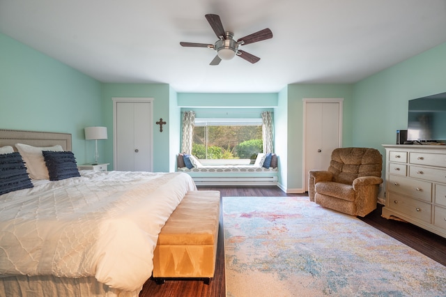 bedroom with dark wood-type flooring and ceiling fan