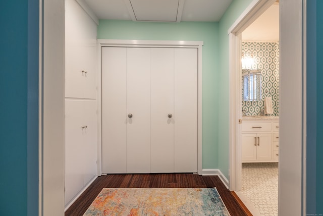 hall with dark hardwood / wood-style flooring