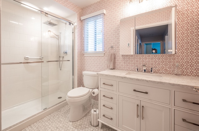 bathroom with a shower with door, tile patterned floors, decorative backsplash, toilet, and vanity