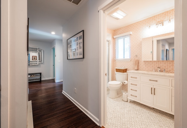 hall with sink and dark hardwood / wood-style flooring