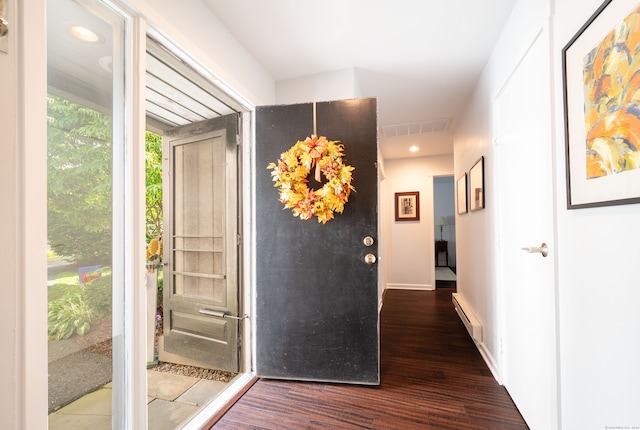 hallway featuring baseboard heating and dark hardwood / wood-style floors