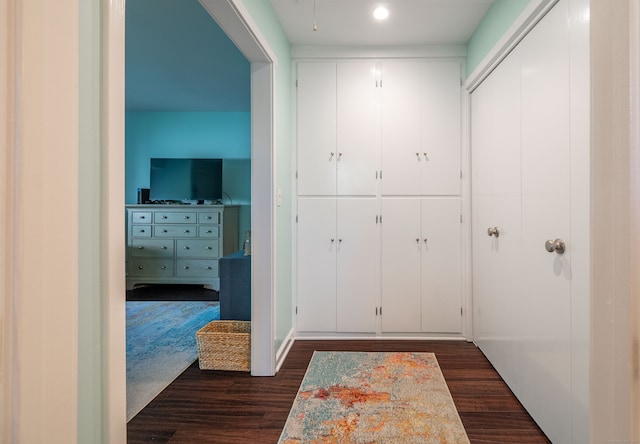 corridor with dark wood-type flooring