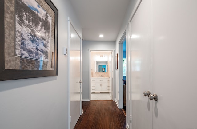 hallway featuring dark hardwood / wood-style flooring