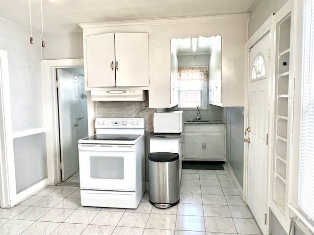 kitchen featuring white electric range, backsplash, sink, ventilation hood, and white cabinetry