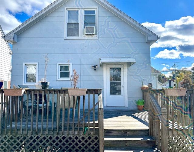 rear view of house featuring a deck