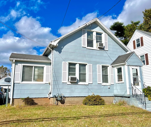 view of home's exterior with a yard and cooling unit