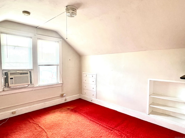 additional living space featuring a textured ceiling, carpet, and vaulted ceiling