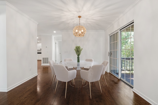 dining space with crown molding, an inviting chandelier, and dark hardwood / wood-style floors