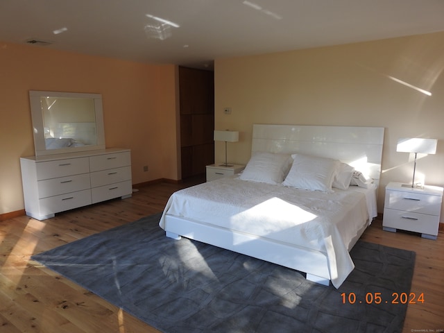 bedroom featuring dark wood-type flooring