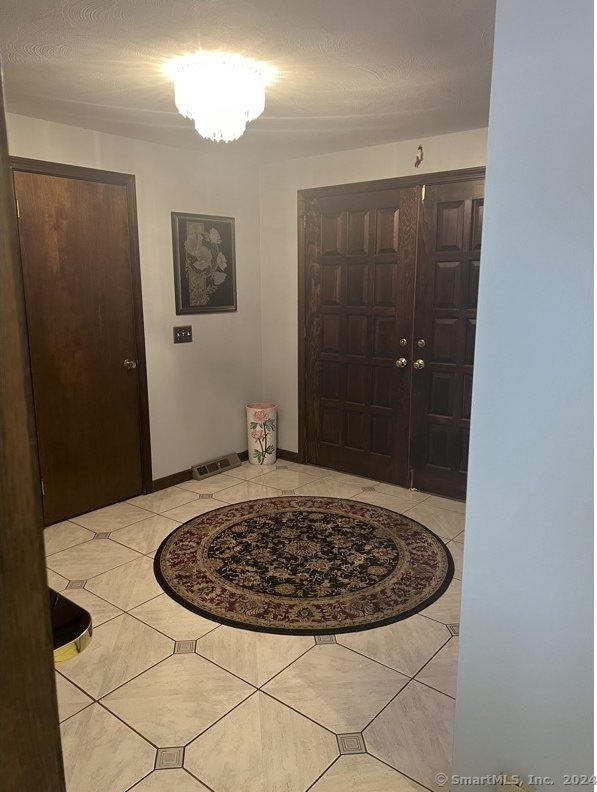 view of tiled foyer entrance