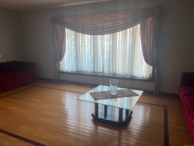 living room with light hardwood / wood-style flooring