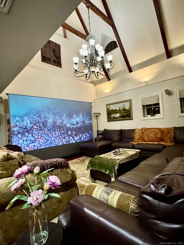 cinema with beam ceiling, high vaulted ceiling, and an inviting chandelier