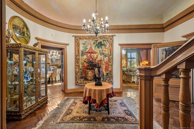 interior space with dark parquet flooring, an inviting chandelier, a raised ceiling, and crown molding