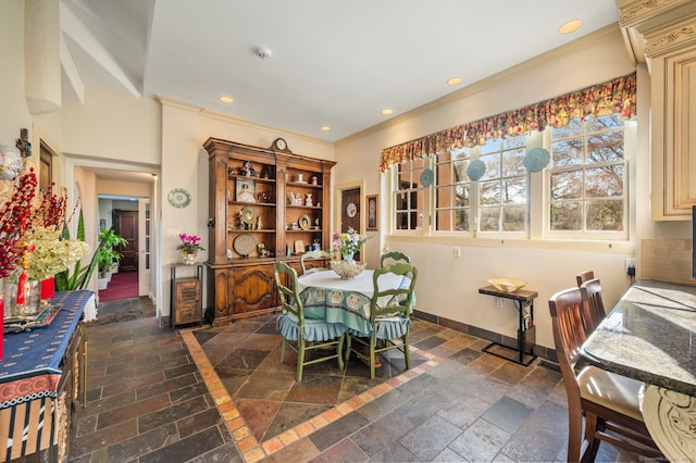 dining area with ornamental molding