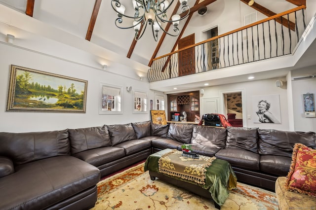 living room with beam ceiling, high vaulted ceiling, and a chandelier