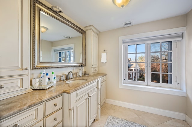 bathroom featuring tile patterned floors and vanity