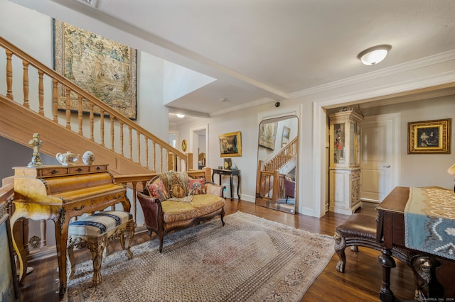 living area with crown molding and dark hardwood / wood-style floors