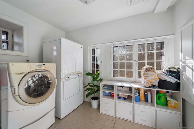 laundry area featuring light tile patterned flooring