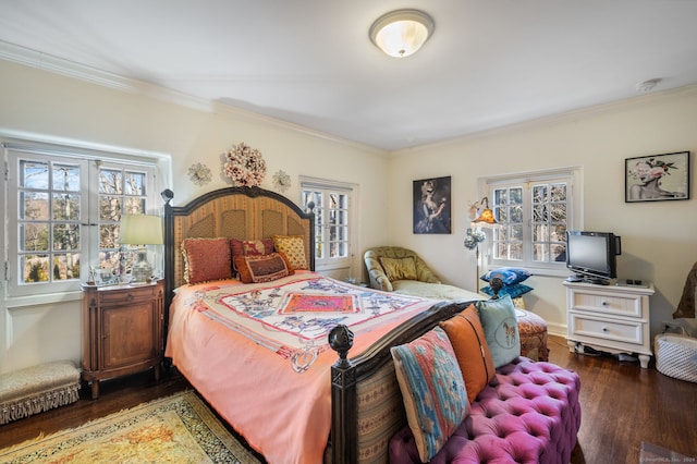 bedroom with multiple windows, crown molding, and dark wood-type flooring