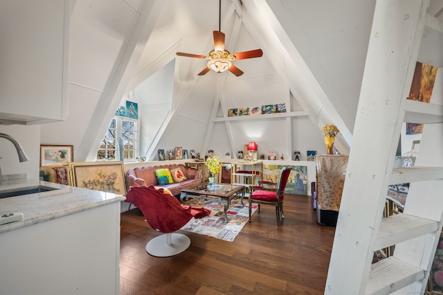 recreation room with vaulted ceiling with beams, ceiling fan, sink, and dark wood-type flooring