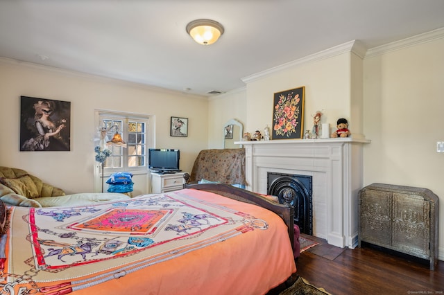 bedroom with dark wood-type flooring and ornamental molding