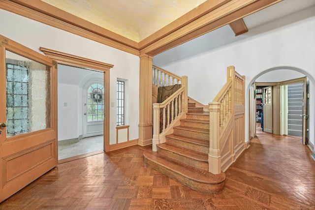 6 Prospect Ct, Hamden, CT 06517 - entryway featuring arched walkways, stairway, and baseboards