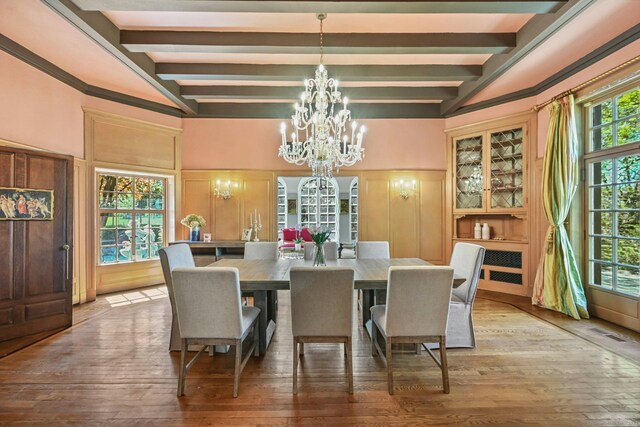 6 Prospect Ct, Hamden, CT 06517 - dining area with a chandelier, a decorative wall, beamed ceiling, hardwood / wood-style flooring, and wainscoting