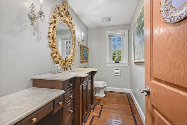 6 Prospect Ct, Hamden, CT 06517 - bathroom featuring baseboards, toilet, vanity, and hardwood / wood-style flooring
