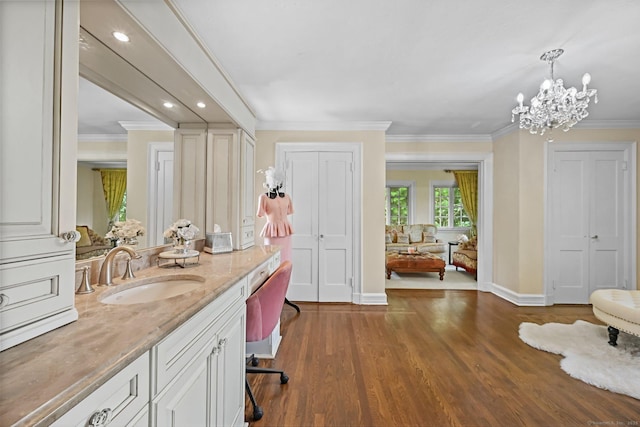 6 Prospect Ct, Hamden, CT 06517 - bathroom with vanity, baseboards, crown molding, a chandelier, and wood finished floors