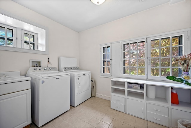 6 Prospect Ct, Hamden, CT 06517 - washroom featuring cabinet space, independent washer and dryer, light tile patterned floors, and baseboards